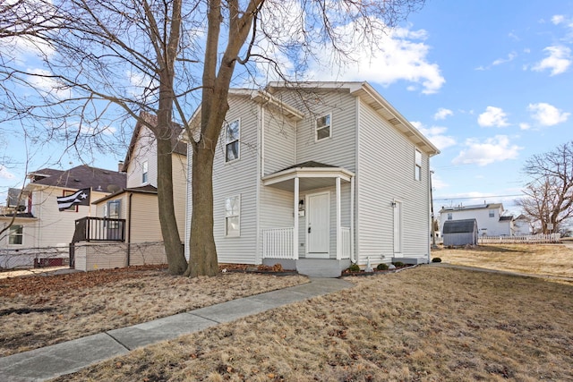 view of front of home featuring fence