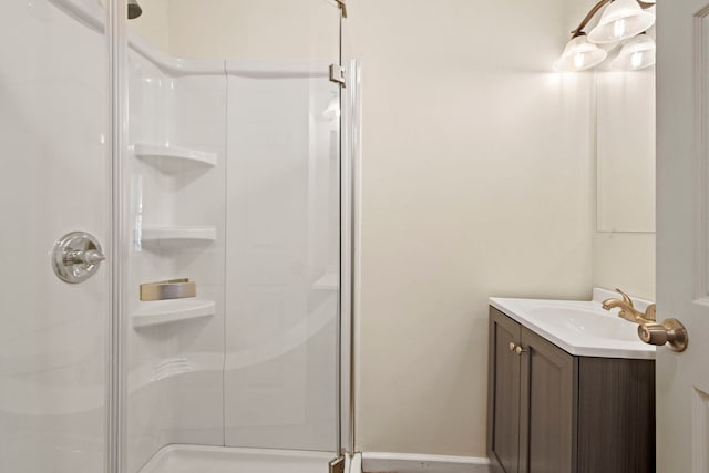 full bath featuring a stall shower and vanity