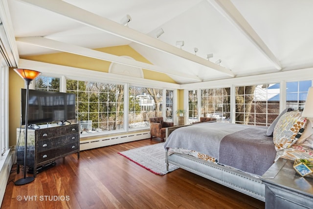 bedroom featuring vaulted ceiling with beams, a baseboard heating unit, and wood finished floors