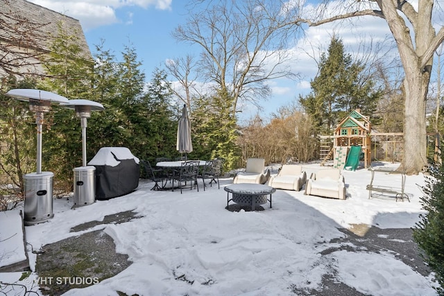 view of yard with outdoor dining area and a playground