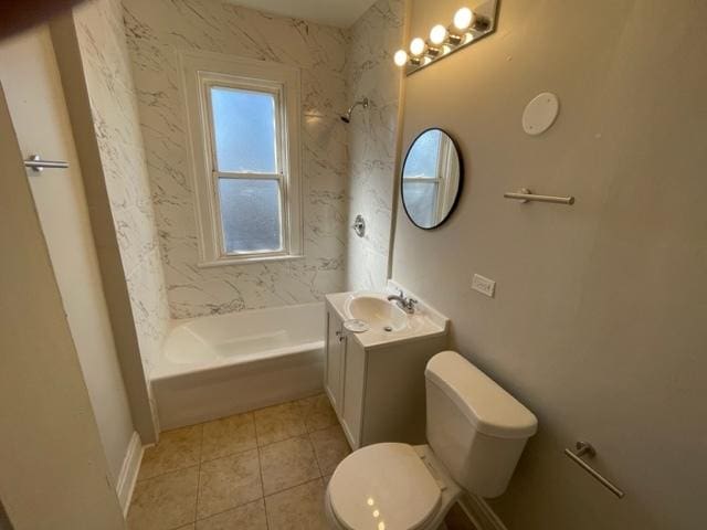 bathroom featuring tile patterned flooring, shower / bathing tub combination, vanity, and toilet