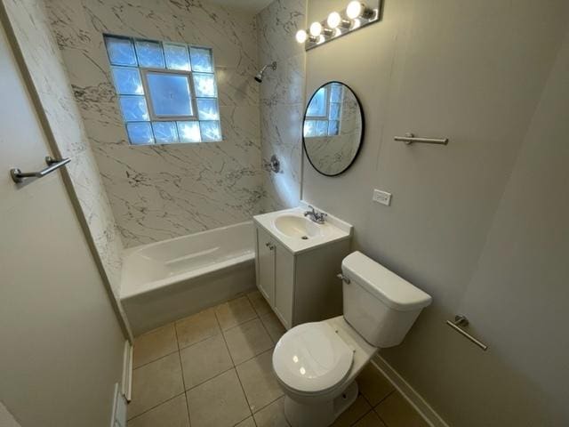 bathroom featuring toilet, bathtub / shower combination, vanity, and tile patterned floors