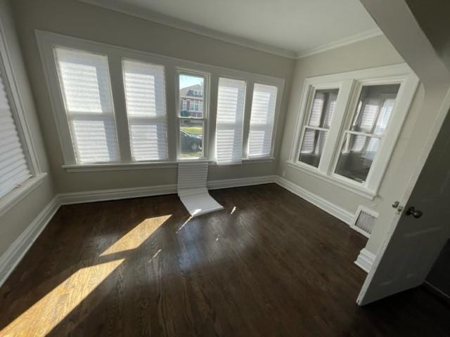 unfurnished sunroom featuring visible vents