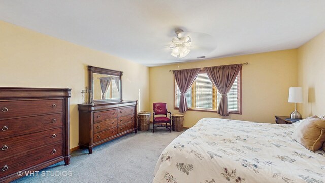 bedroom featuring light carpet and visible vents