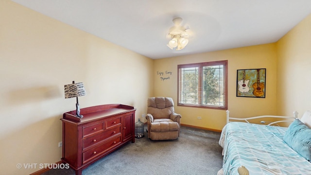 carpeted bedroom featuring baseboards