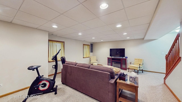 carpeted living room featuring stairs, a drop ceiling, recessed lighting, and baseboards