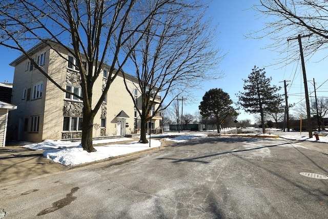 view of road with curbs and sidewalks