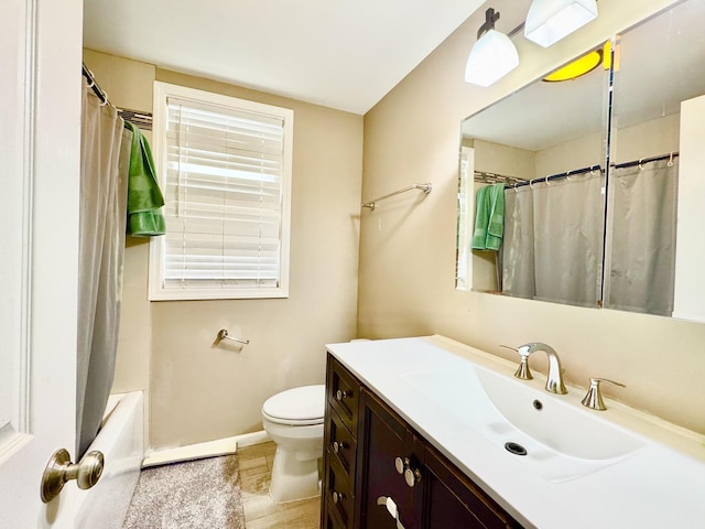 full bath featuring toilet, shower / bathtub combination with curtain, vanity, and baseboards