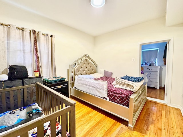 bedroom featuring wood finished floors