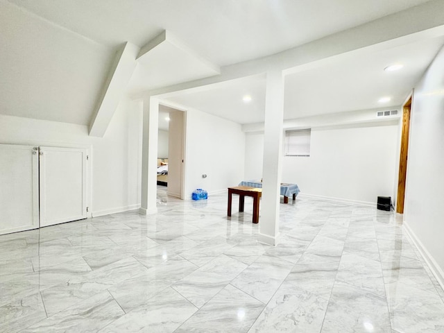 bonus room with marble finish floor, visible vents, and baseboards