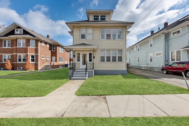 traditional style home with a front yard