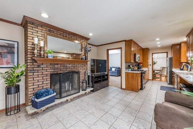 living area with light tile patterned floors, recessed lighting, a fireplace, baseboards, and ornamental molding