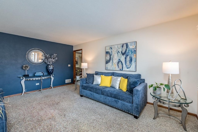 carpeted living area with visible vents and baseboards