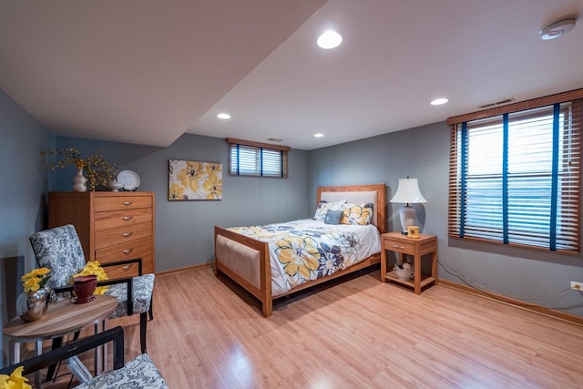 bedroom featuring recessed lighting, light wood-style flooring, and baseboards