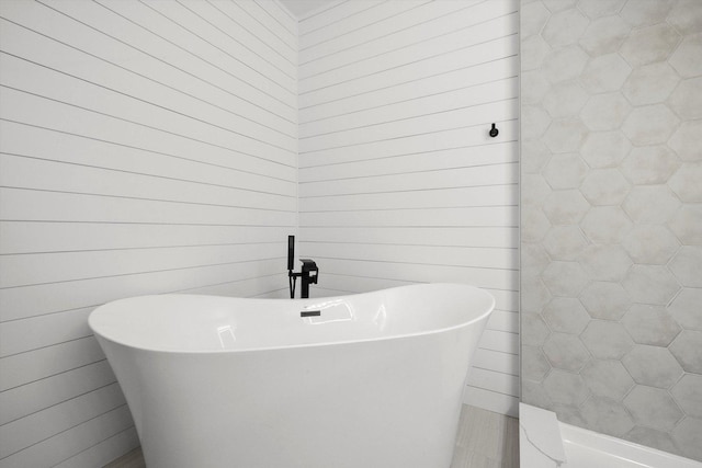 bathroom featuring a freestanding tub