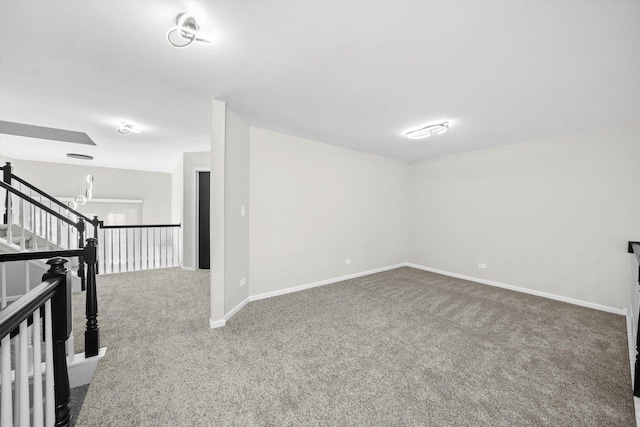 below grade area featuring carpet and baseboards