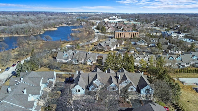 bird's eye view featuring a residential view and a water view