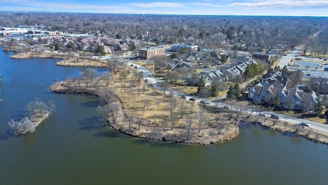 drone / aerial view featuring a residential view and a water view