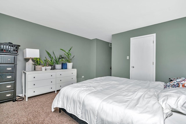 bedroom with light carpet