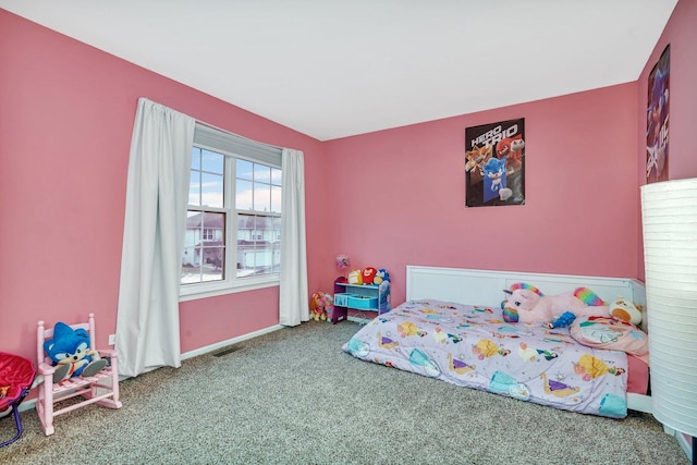 carpeted bedroom featuring visible vents