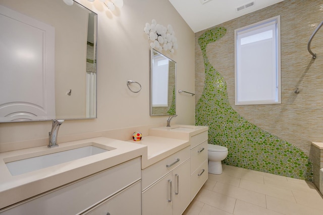 full bath featuring visible vents, vanity, toilet, and tile patterned floors