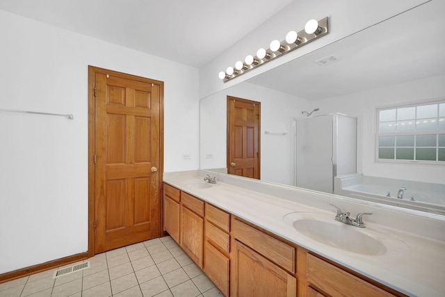 full bathroom featuring a stall shower, visible vents, a sink, and tile patterned floors