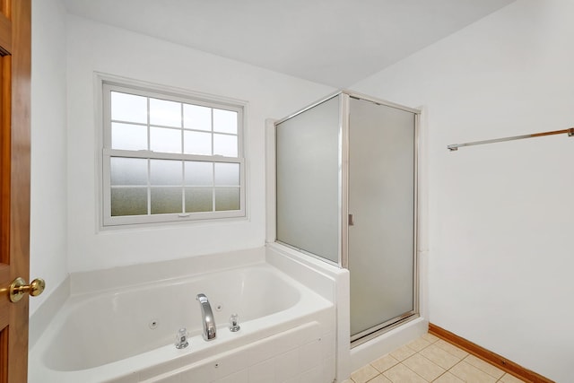 full bathroom with baseboards, a jetted tub, tile patterned flooring, and a stall shower