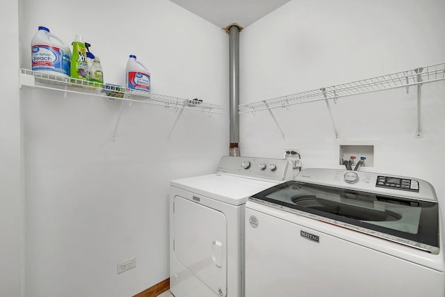 washroom featuring laundry area and independent washer and dryer