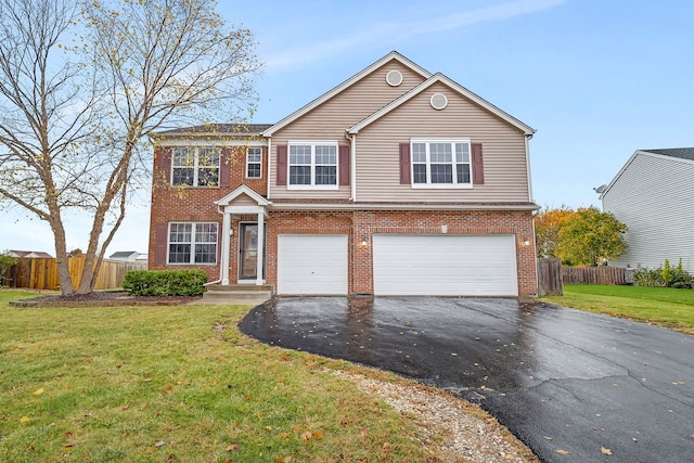 traditional-style home with aphalt driveway, a front lawn, and fence