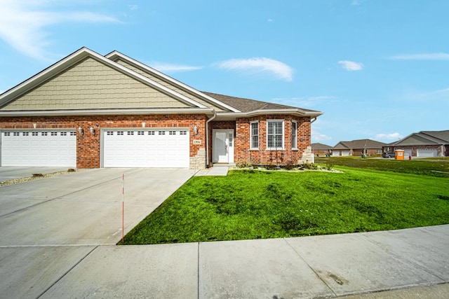 view of front of home with a front yard, concrete driveway, brick siding, and an attached garage