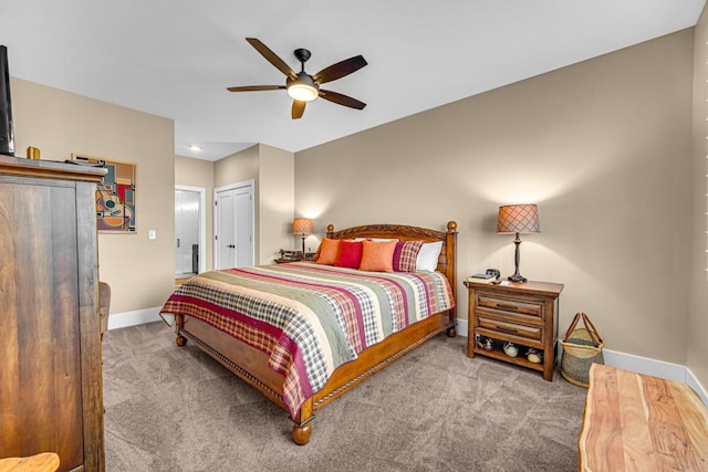 carpeted bedroom featuring a closet, baseboards, and a ceiling fan