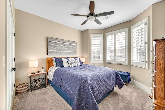 bedroom featuring a ceiling fan, carpet, visible vents, and baseboards