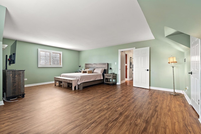 bedroom with dark wood-style flooring and baseboards