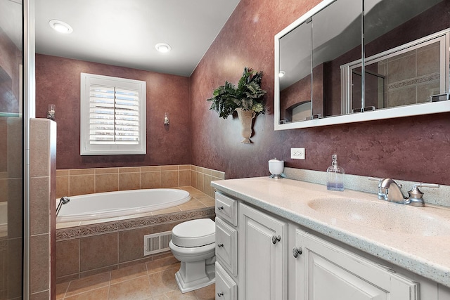 full bathroom with a garden tub, visible vents, a tile shower, vanity, and tile patterned flooring