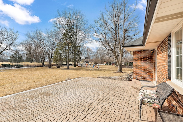 view of patio featuring a playground