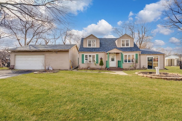 view of front of property with an attached garage, driveway, and a front yard