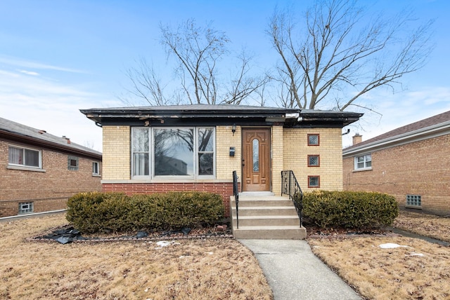 view of front of house with brick siding