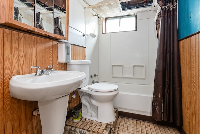 bathroom with toilet and shower / bath combo with shower curtain