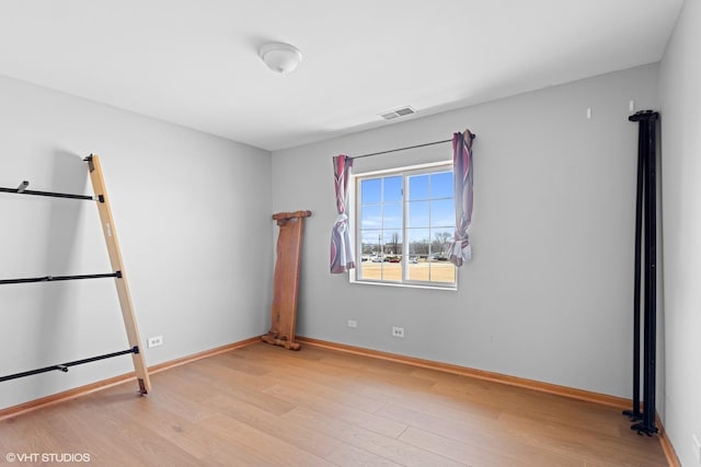 unfurnished bedroom featuring light wood-type flooring, visible vents, and baseboards