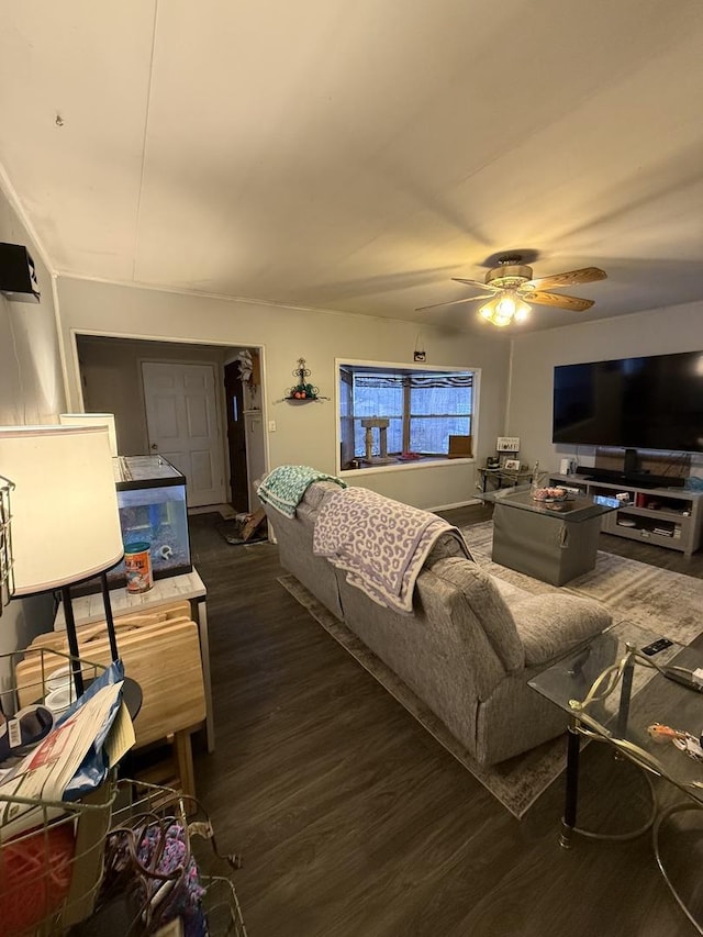 living room with ceiling fan and dark wood-type flooring