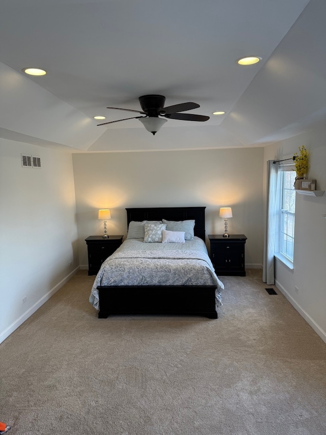 carpeted bedroom with a ceiling fan, recessed lighting, visible vents, and baseboards