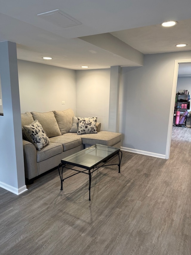 living area featuring dark wood-style floors, recessed lighting, and baseboards