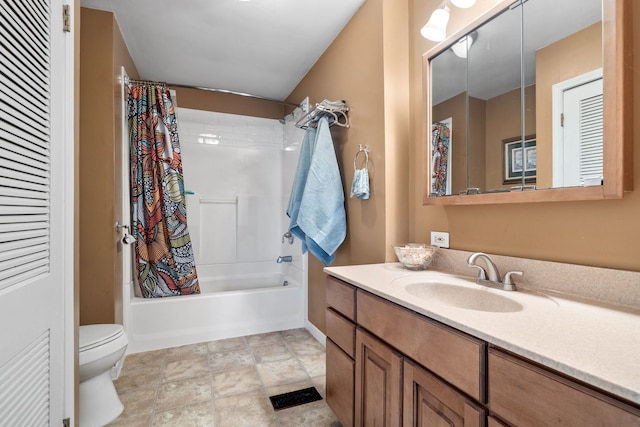 full bathroom with shower / tub combo, vanity, and toilet