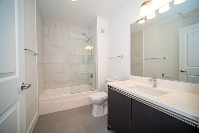 bathroom featuring shower / washtub combination, vanity, and toilet