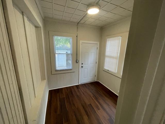 entryway with dark wood-style flooring