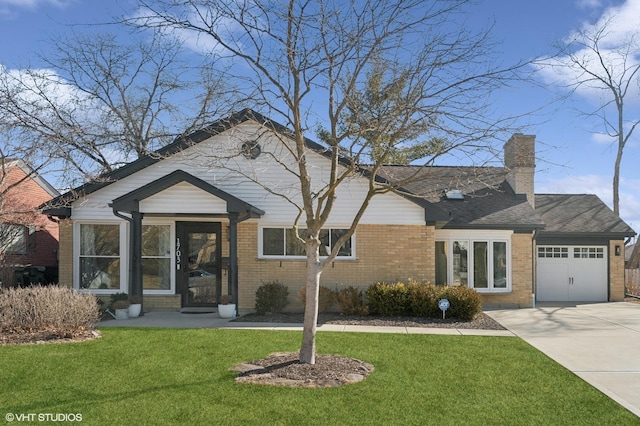 view of front facade with a garage, driveway, a chimney, a front lawn, and brick siding