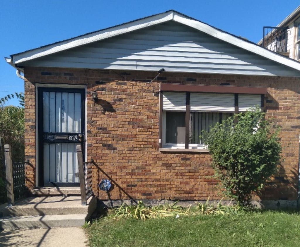 exterior space featuring brick siding