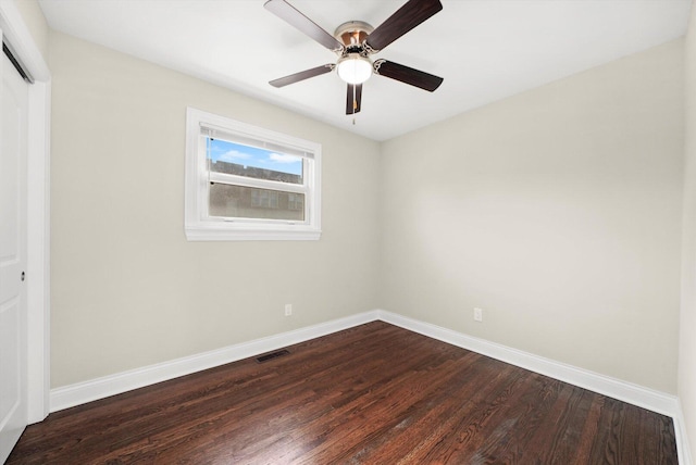 457 E 91st St, Chicago, IL 60619 - unfurnished bedroom featuring baseboards, a closet, dark wood-type flooring, and a ceiling fan