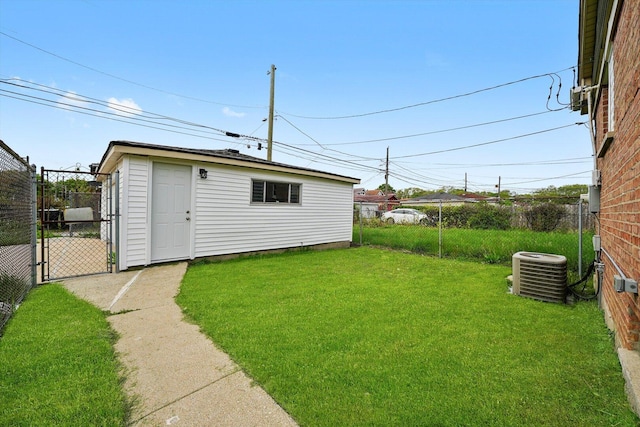 457 E 91st St, Chicago, IL 60619 - view of yard featuring central AC unit and a gate