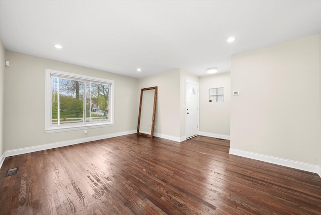 457 E 91st St, Chicago, IL 60619 - unfurnished living room featuring wood finished floors, baseboards, and recessed lighting